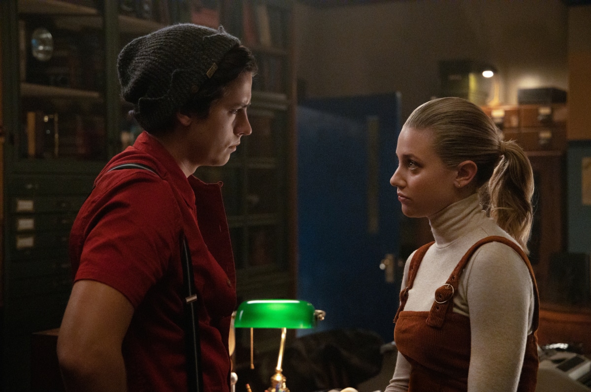 Riverdale -- "Chapter Sixty-Seven: Varsity Blues" -- Image Number: RVD410a_0273.jpg -- Pictured (L-R): Cole Sprouse as Jughead and Lili Reinhart as Betty -- Photo: Jack Rowand/The CW-- © 2020 The CW Network, LLC All Rights Reserved.