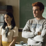 Riverdale’-Season-5-Episode-6-Camila-Mendes-as-Veronica-Lodge-and-KJ-Apa-as-Archie-Andrews-in-the-high-school-after-the-seven-year.