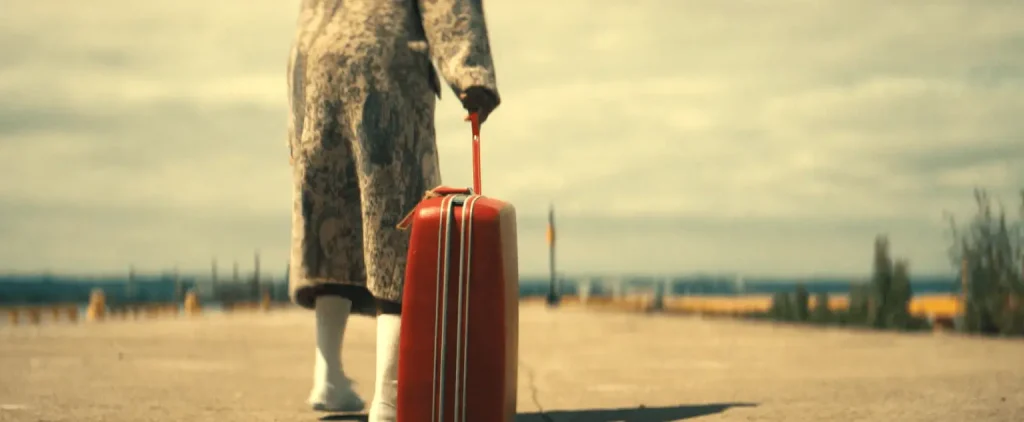 What is the Significance of the Red Suitcase